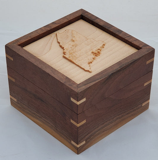 Walnut keepsake box or pet urn with a carved Maine top cover