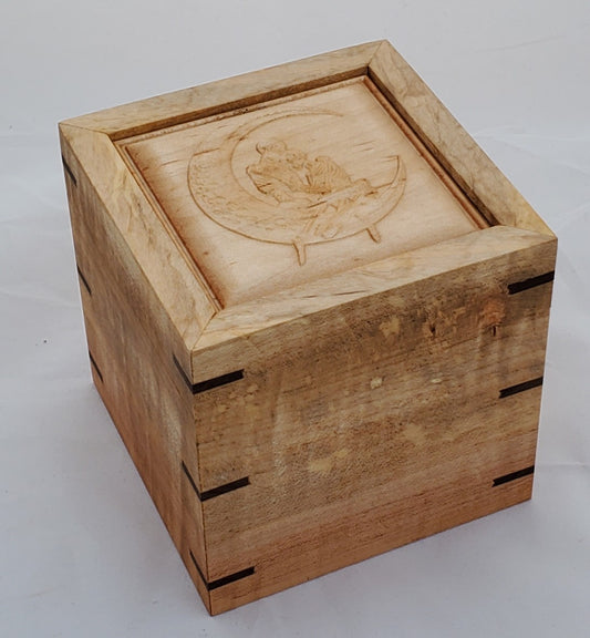 Maple keepsake box or pet urn with a carved Skeletons holding each other while sitting on the moon