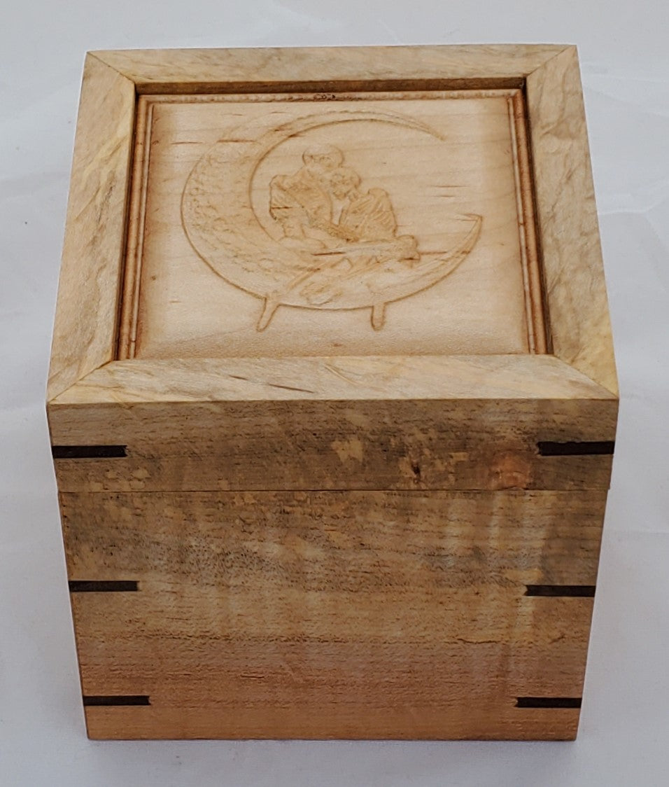 Maple keepsake box or pet urn with a carved Skeletons holding each other while sitting on the moon