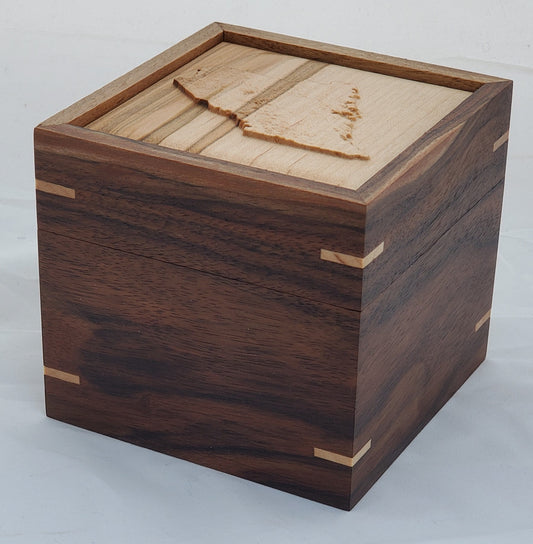 Walnut keepsake box or pet urn with a carved Maine top cover